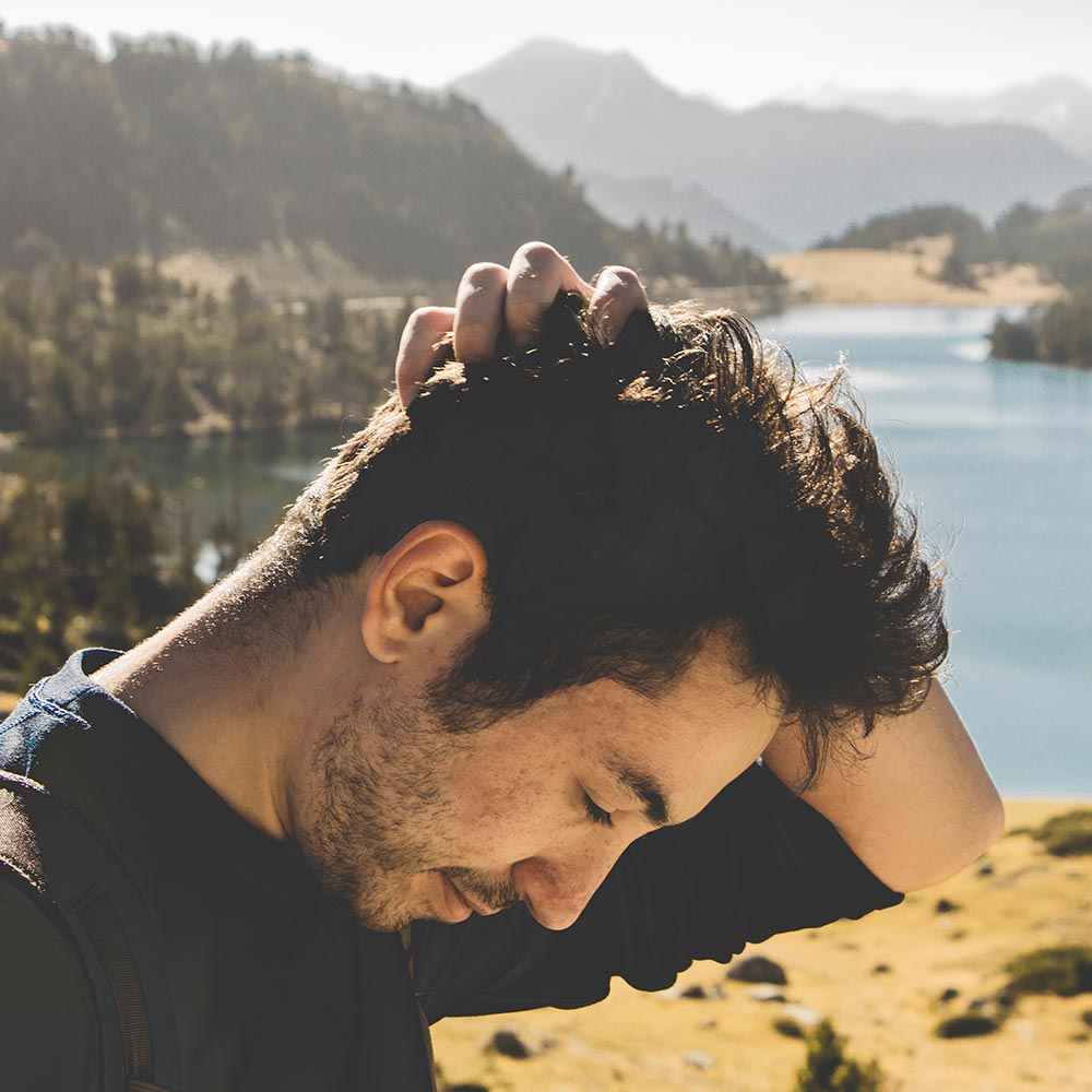 A side portrait photo of me taken while hiking